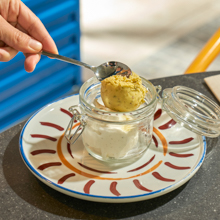 Two scoops of ice cream to choose from mascarpone, pistachio, yogurt, vanilla, chocolate, and raspberry sorbet