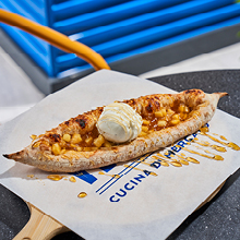 Apple compote, apricot jam and vanilla ice cream on a warm pizza dough. The perfect dessert to share.