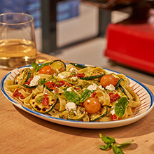 Zucchini, feta cheese, pesto, cherry and semi-dried tomatoes, and pistachio dust. Our take on the classic Sorrentina recipe