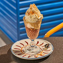 Hazelnut cream cup with hazelnut and chocolate ice cream, wafer, and whipped cream